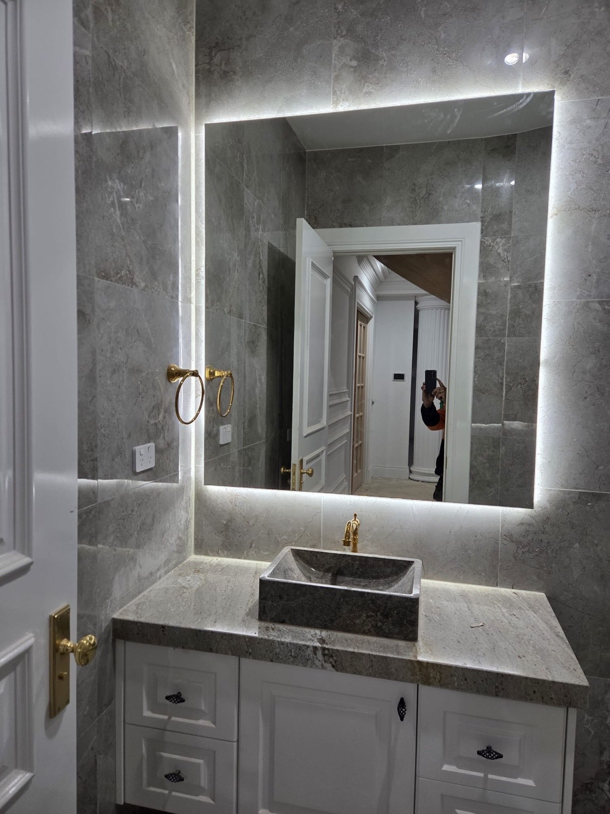 Bathroom vanity with stone vessel sink