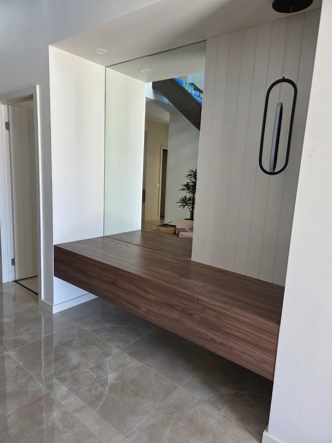 Floating walnut hall bench with mirror