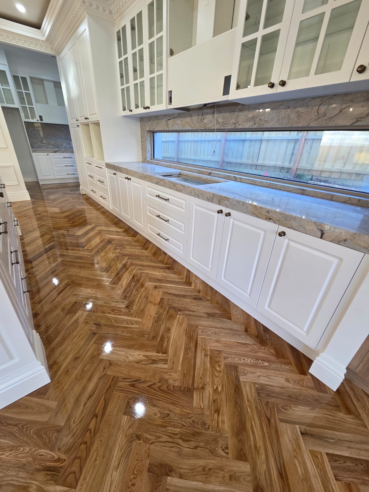 Custom white shaker kitchen cabinetry designed for a Melbourne home