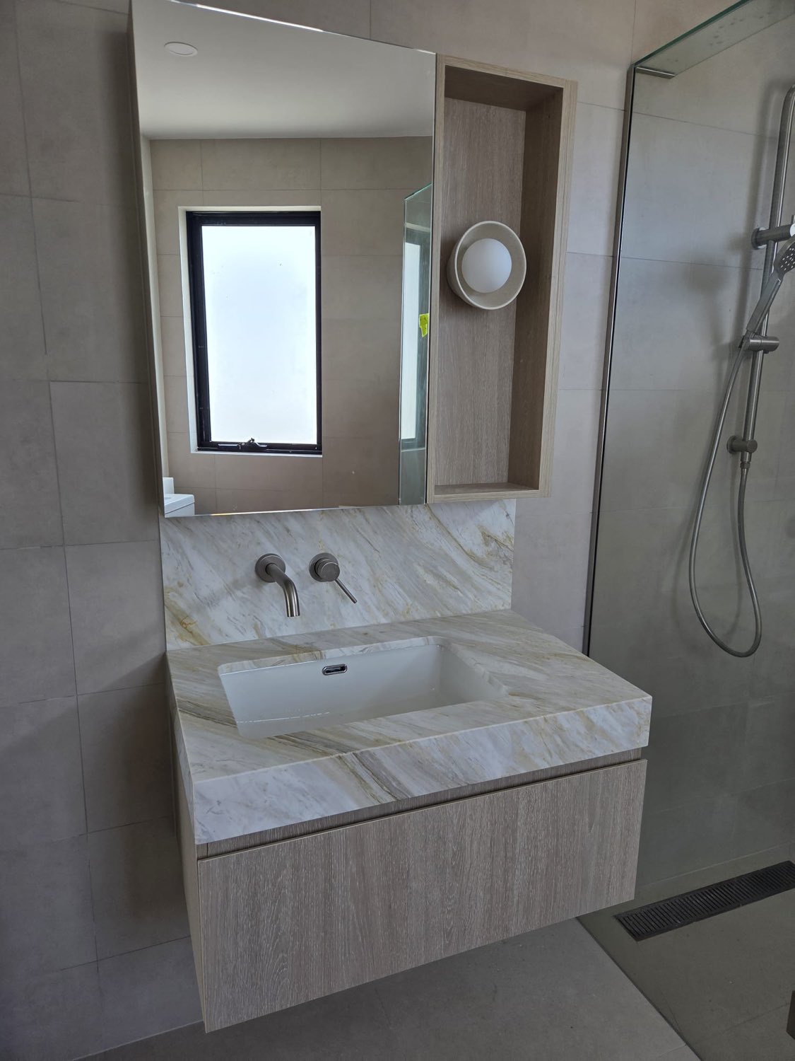 Floating timber vanity with marble benchtop