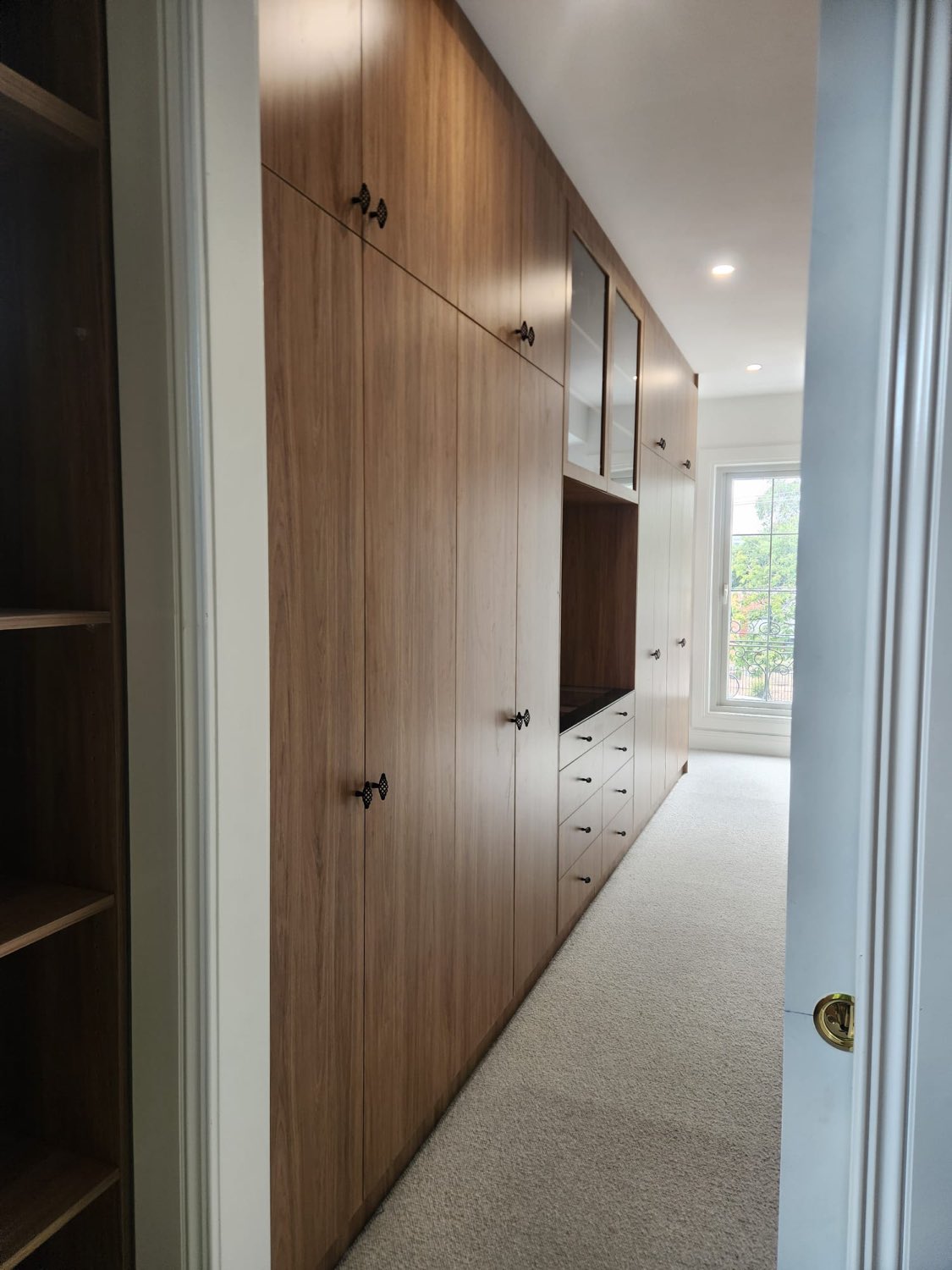 Timber walk-in wardrobe with open shelving