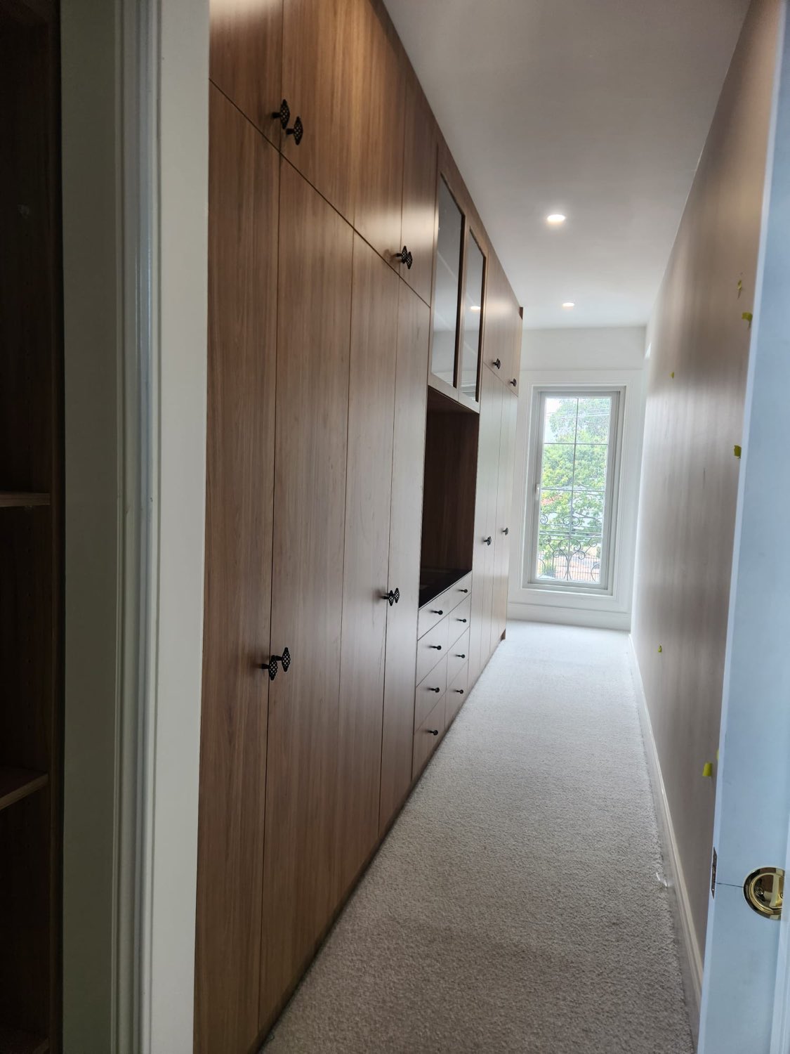 Timber walk-in wardrobe with window