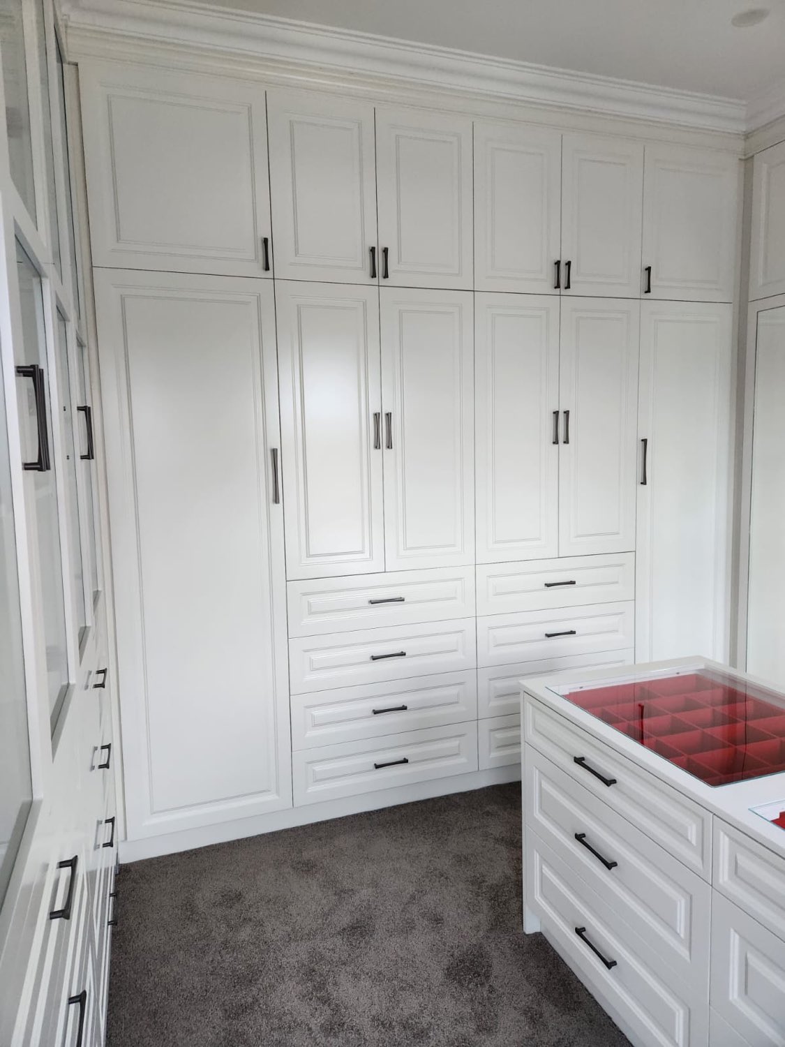 White wardrobe room with drawer island